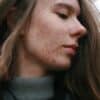 a woman with a substance on her face