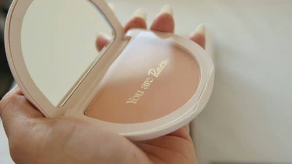 A person holding a compact compact compact compact compact compact compact compact compact compact compact compact
