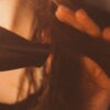 woman blowdrying hair