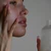 a person holding a bottle