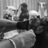 grayscale photo of woman holding hair blower