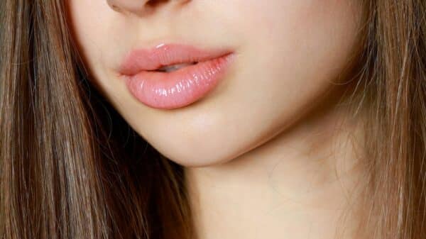 a close up of a woman with long brown hair