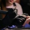 a woman getting her nails done at a salon