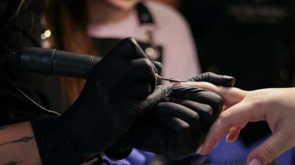 a woman getting her nails done at a salon