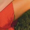 person in red and white polka dot shorts