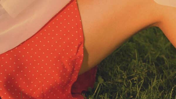 person in red and white polka dot shorts