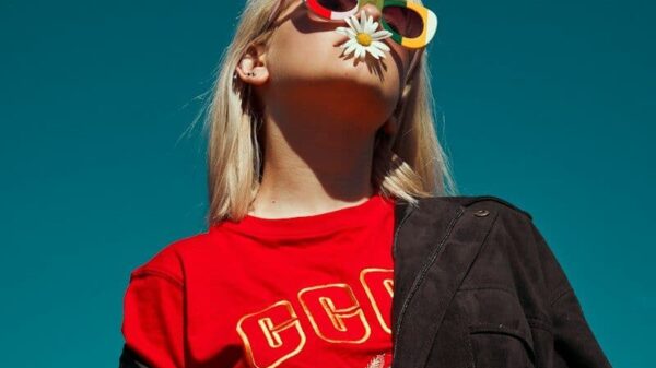 woman with sunglasses standing outdoor during daytime