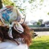 a woman in a park with a bandana on her head
