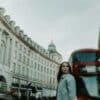 a woman standing in the middle of a street