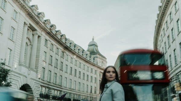 a woman standing in the middle of a street