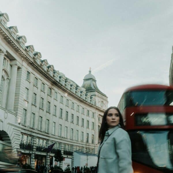 a woman standing in the middle of a street