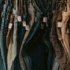 A rack of jeans hanging on a wall